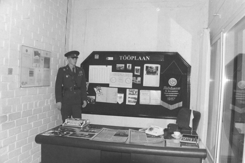 Black and white photograph of a Soviet-era uniforms and office