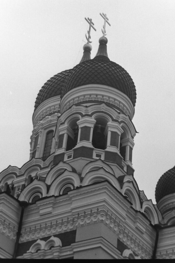 Black and white photo of the onion domes on a Russian style cathedral.