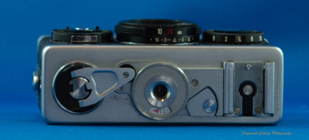 Photograph of the underside of a Rollei 35 camera.