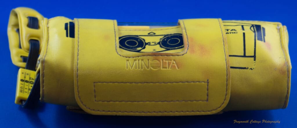 Photograph of the Minolta Weathermatic A in the wrap-around case.